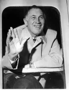 00392 Prints: Manchester City Manager Joe Mercer waves to well wishers as the teams train pulls out of