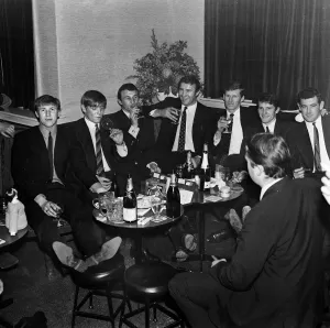 Team Prints: Manchester City players and management staff celebrate with a few drinks