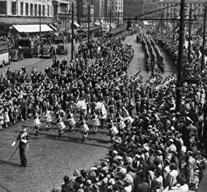 The Manchester Regiment led by the band seen here marching pass Piccadilly Gardens