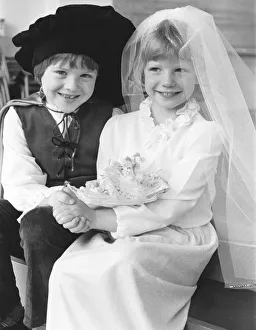 Manchester schoolchildren dressed as a happy couple on their wedding day for