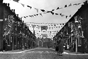 Bunting Prints: A Manchester street decked out with coronation decorations in celebration of