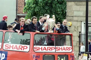 01242 Prints: Manchester United celebrate winning the treble as the jubilant team make their way