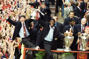 01242 Prints: Manchester United celebrate winning the treble as the jubilant team make their way