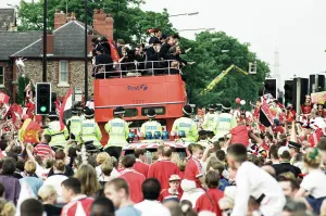 01242 Prints: Manchester United celebrate winning the treble as the jubilant team make their way