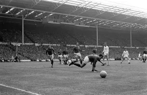 00245 Prints: Manchester United defence watch the ball go to safety during the Manchester United