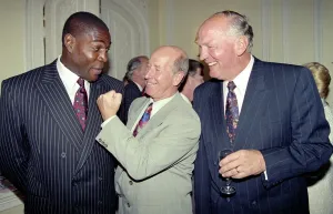 00244 Prints: Former Manchester United and England footballer Bobby Charlton hams it up with boxers