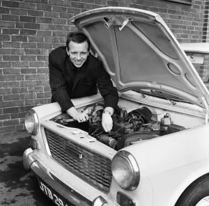 Mechanic Prints: Manchester United and England footballer Nobby Stiles tends to his car engine at Old
