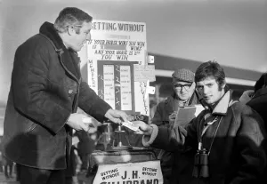Bookmaker Prints: Manchester United football player Willie Morgan at Haydock races