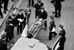 Manchester United Football Team return after winning the European Cup - An injured fan is