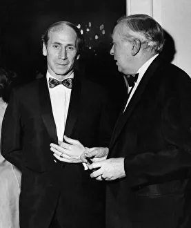 Reception Prints: Manchester United footballer Bobby Charlton talking to Prime Minister Harold Wilson at a