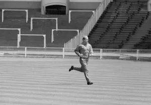 Manchester United footballer Bobby Charlton warms up at an empty Wembley Stadium prior to