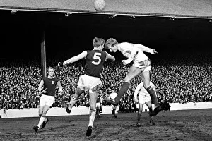 Manchester United footballer Denis Law gets in before Burnley defender Colin Waldron to