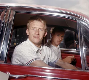 Manchester United footballer Denis Law in his red Jaguar July 1964