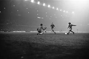 Three People Prints: Manchester United footballer George Best in action against Chelsea