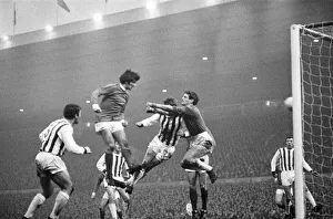 00387 Prints: Manchester United footballer George Best in action to score his second goal with a header