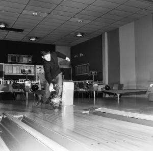 Manchester United footballer George Best bowling at the Top Rank Bowl near Trafford