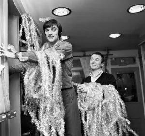 Tinsel Prints: Manchester United footballer George Best decorating his Edwardian boutique 7th