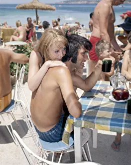 Wags Prints: Manchester United footballer George Best on holiday with girlfriend Susan George while