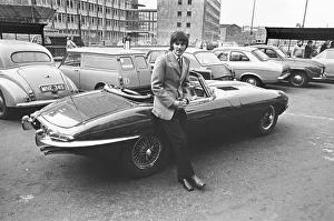 Footballer Prints: Manchester United footballer George Best with his Jaguar E-Type outside his boutique in