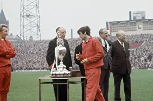 Medals Prints: Manchester United footballer George Best picks up his medal during the League
