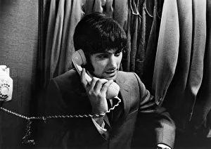 Girlfriend Prints: Manchester United footballer George Best at Taylors taking a phone call, circa 1966
