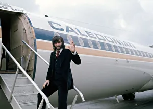 Beard Prints: Manchester United footballer George Best waves before boarding his plane October