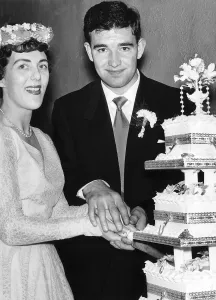 00357 Prints: Manchester United footballer Jackie Blanchflower cuts the wedding cake on his wedding day