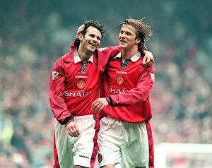 Embracing Prints: Manchester United footballer Ryan Giggs celebrates a goal with teammate David Beckham