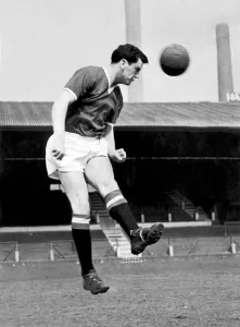 00440 Prints: Manchester United footballer Tommy Taylor in heading practice at Old Trafford, circa 1957