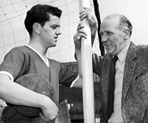 Manchester United footballer Tommy Taylor with his manager Matt Busby, circa 1957