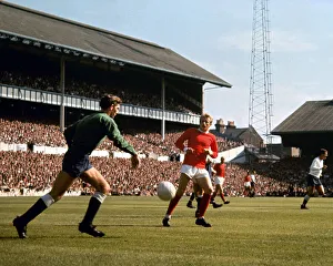 manchester United forward Denis LAw scores past Tottenham Hotspur goalkeeper Pat Jennings