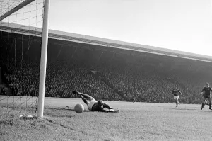 Manchester United goalkeeper Alex Stepney tips a shot from Liverpool forward ian Saint