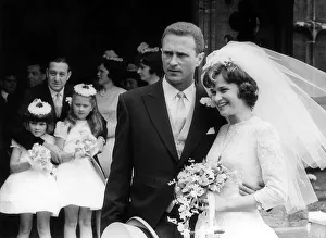 Manchester United goalkeeper Harry Gregg with his bride Carolyn Mauders watched by