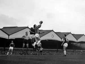 Manchester United goalkeeper Harry Gregg claims a high ball in his penalty area during