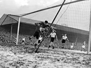 Manchester United inside right leaps to a shot from Edwards which is saved by Reading