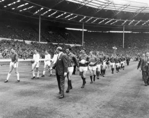 Manchester United and Leicester City walk out on to the pitch at Wembley at the start of