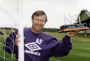 00468 Prints: Manchester United manager Alex Ferguson holding his Carling Manager of the Month Award