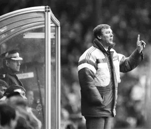 Dugout Prints: Manchester United manager Alex Ferguson shouts instructions from the dugout during his
