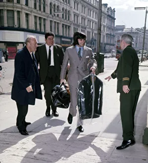 Manchester United and Northern Ireland footballer George Best arrives with a clean suit