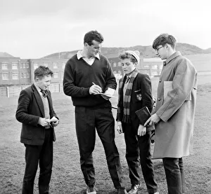 Manchester United Player Noel Cantwell signing autographs whilst playing Golf