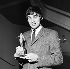 00475 Prints: Manchester United star George Best holding his Footballer of the Year trophy