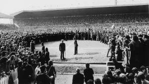 00330 Prints: Manchester United supporters crowd onto the pitch at Old Trafford to celebrate their