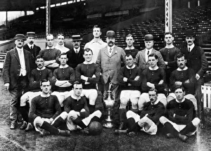 1911 Prints: Manchester United team pose for a group photograph with the League Championship trophy