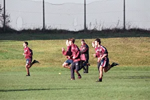 Manchester United in training. David Beckham running with Gary and Phil Neville