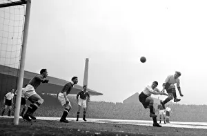 00238 Prints: Manchester United versus Aston Villa Pace (left0 leaps higher than colleague Dixon