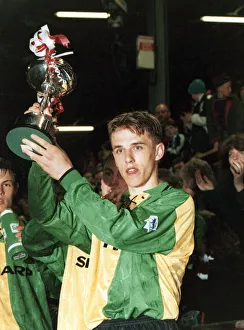 Manchester United youth team captain Philip Neville holds up the FA Lancashire Youth Cup
