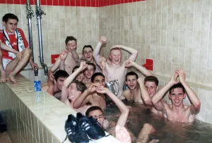 Manchester United youth team celebrate in the bath with the FA Youth Cup trophy after