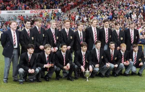 Manchester United youth team players take a bow before the senior team