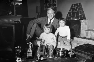 01249 Prints: Manchester Uniteds Bobby Charlton shows off his many trophies that he has won to his