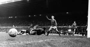 Manchester Uniteds Denis Law appeals for a corner kick as Ipswich goalkeeper hancock